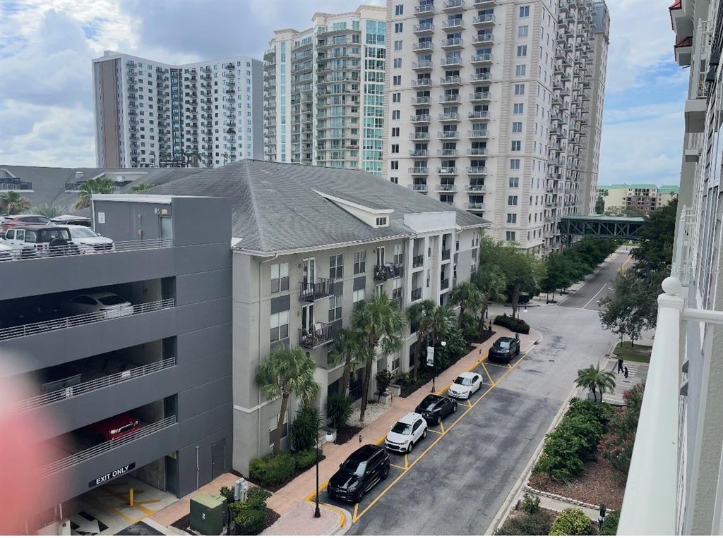 An elevated view shows a parking garage, a multi-story apartment building, and street-side parking — 700 S HARBOUR ISLAND BOULEVARD UNIT 536, TAMPA, FL