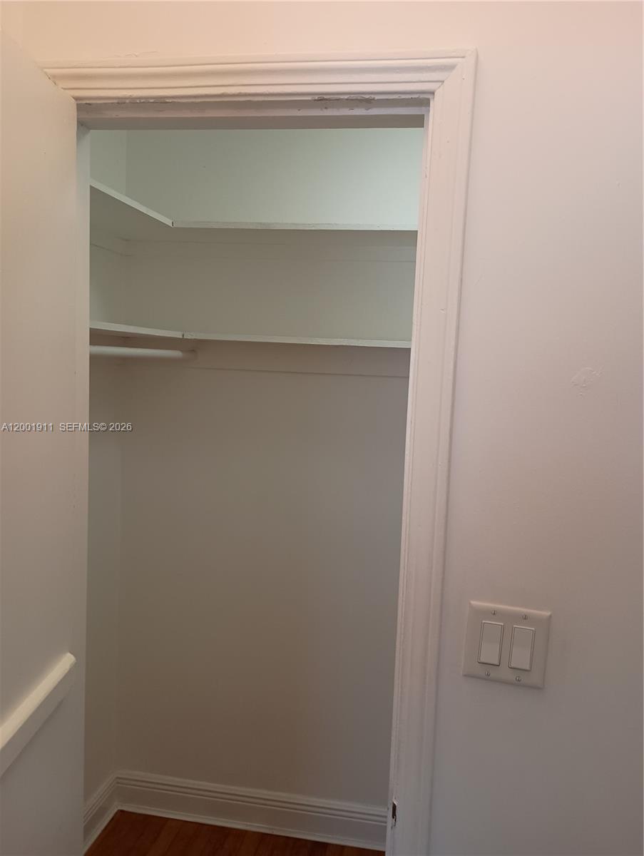 A closet with white shelving and a hanging rod is visible through an open doorway — 535 74 # 11, Miami Beach FL 33141, MIAMI BEACH, FL