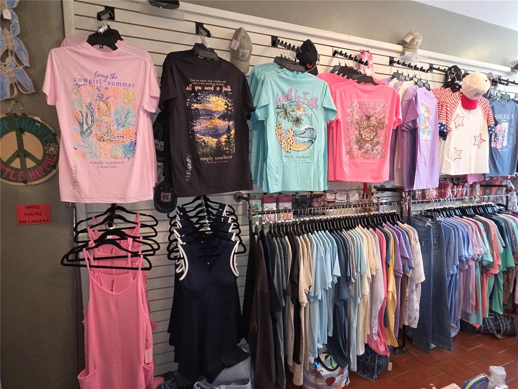 Shelves are stocked with various bottles of wine, beer, and colorful decorative glassware — 30 E MAGNOLIA AVENUE, EUSTIS, FL
