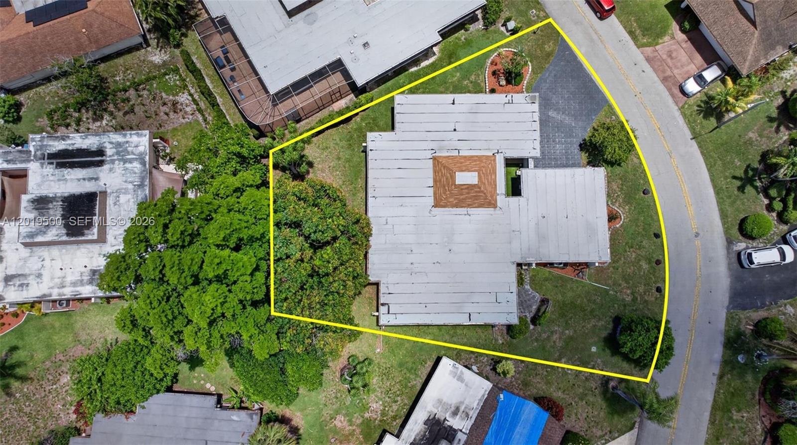 An aerial view shows a house with a flat roof and a central skylight — 4806 Banyan Ln, Tamarac FL 33319, TAMARAC, FL