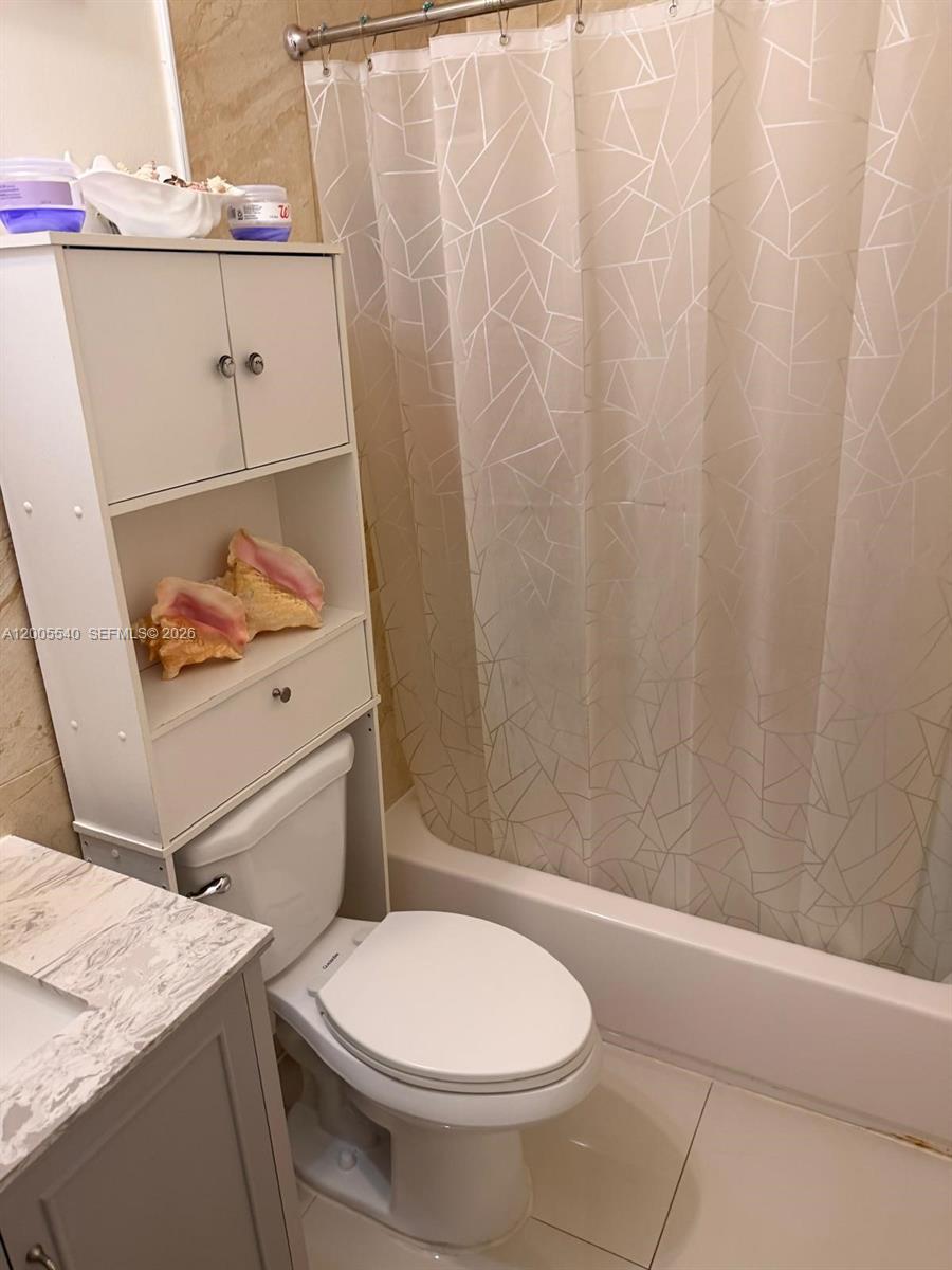 A bathroom features a white over-the-toilet storage unit, a toilet, and a geometric shower curtain — 2835 SW 37th Ct # 1, Miami FL 33134, MIAMI, FL