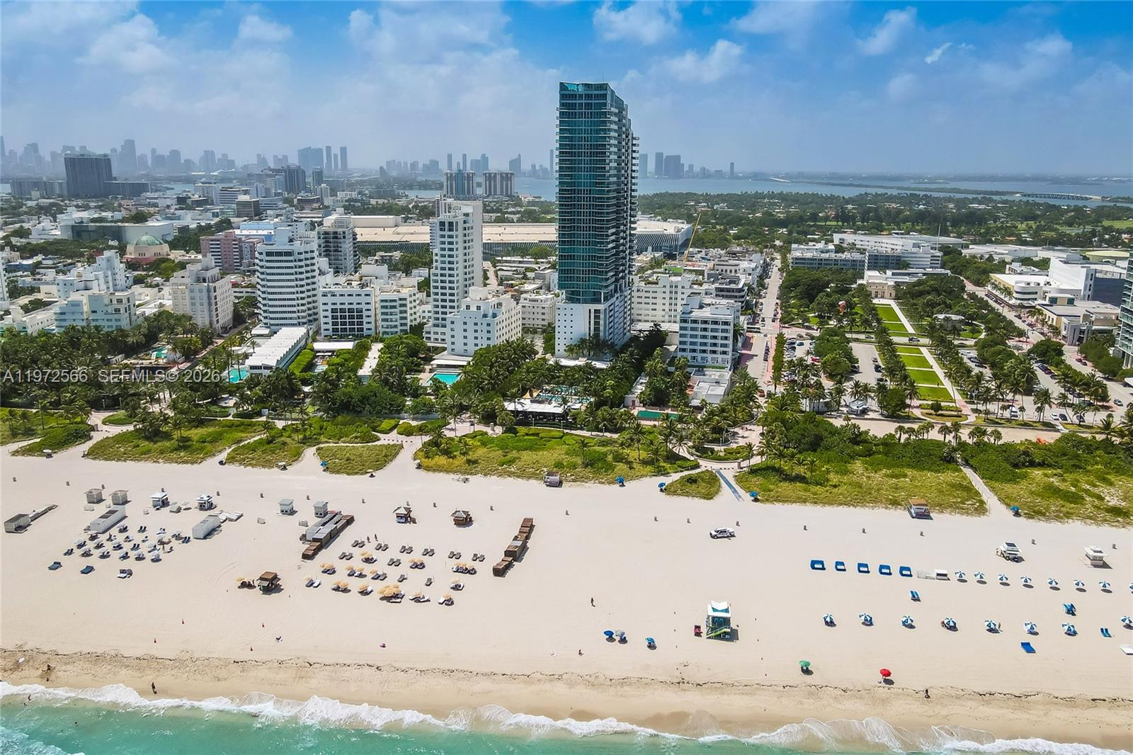 An aerial view of a sandy beach in front of a city skyline and skyscrapers — 101 20th St # 3806, Miami Beach FL 33139, MIAMI BEACH, FL