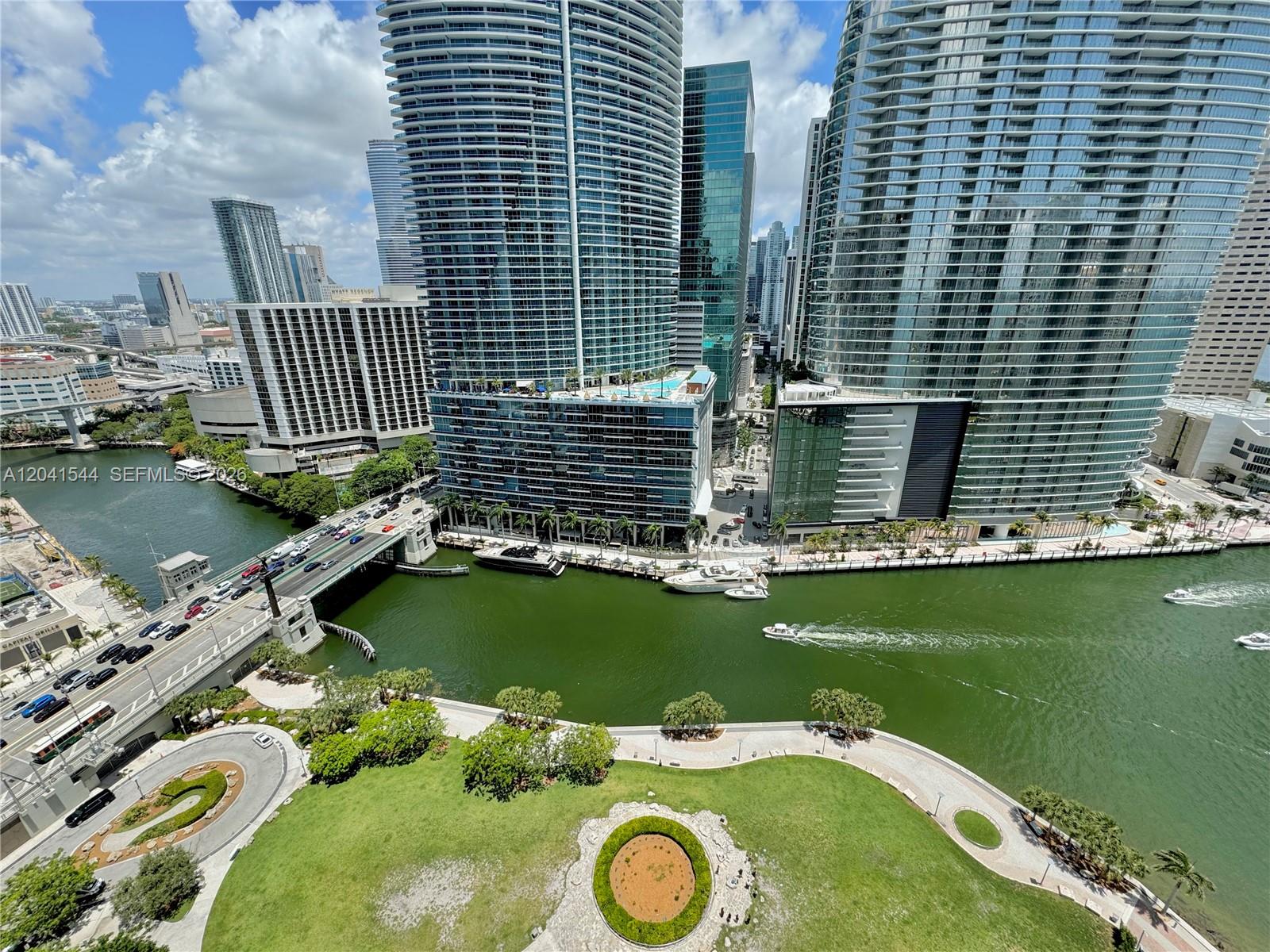 An elevated view shows a river, a bridge, and modern skyscrapers in Miami — 475 Brickell Ave # 2512, Miami FL 33131, MIAMI, FL