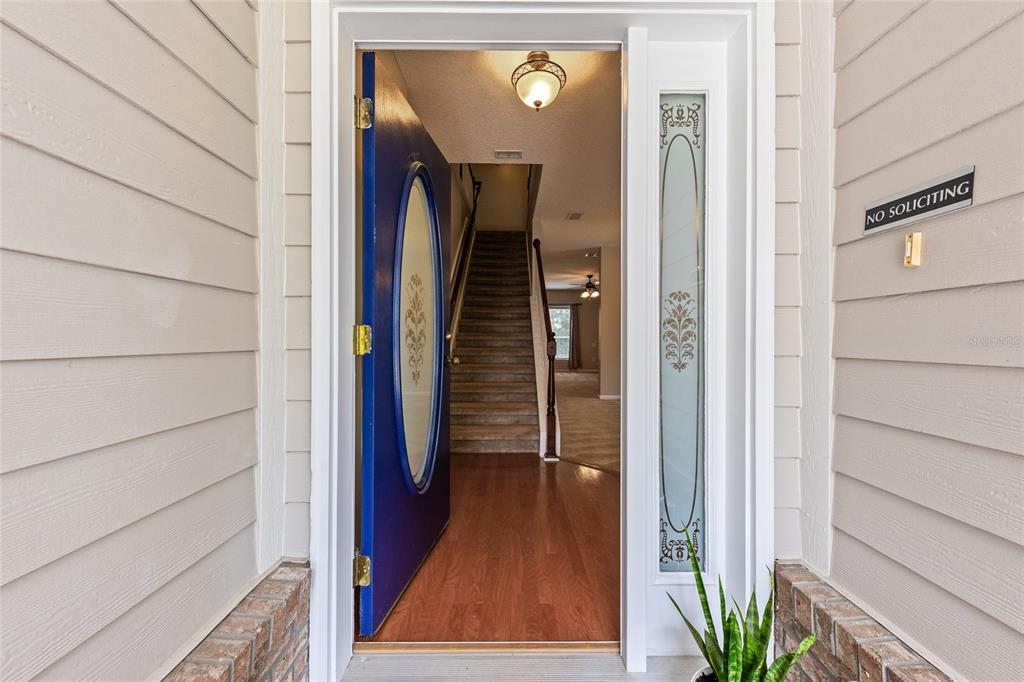 A kitchen features wood cabinets, granite countertops, stainless steel appliances, and a central island — 741 FLOWERS STREET, ST AUGUSTINE, FL