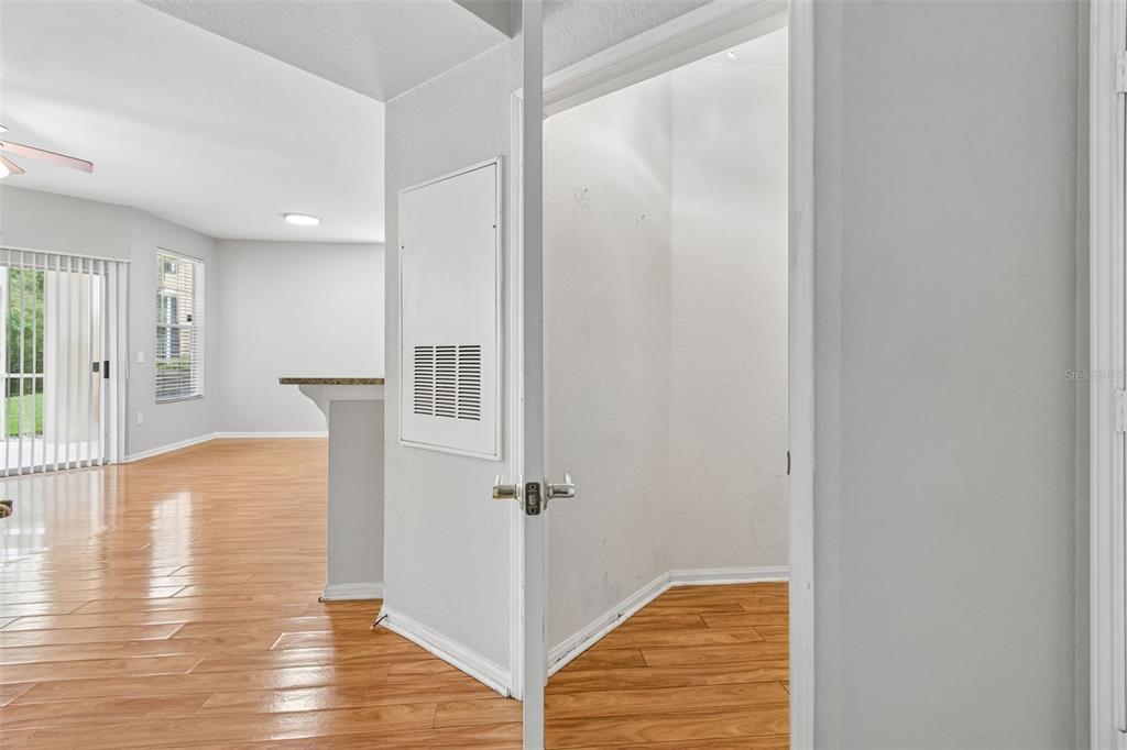 A view from a doorway looking into a small room with wood-look flooring — 5125 PALM SPRINGS BOULEVARD UNIT 15105, TAMPA, FL
