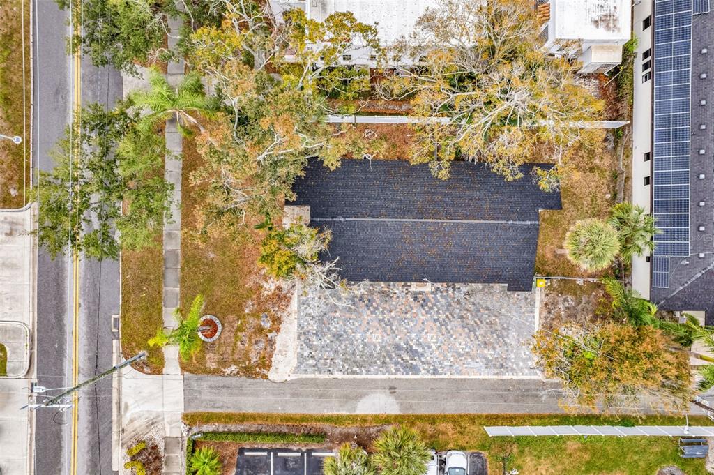An aerial view shows a house with a dark roof and a large paved driveway — 721 N OSPREY AVENUE, SARASOTA, FL