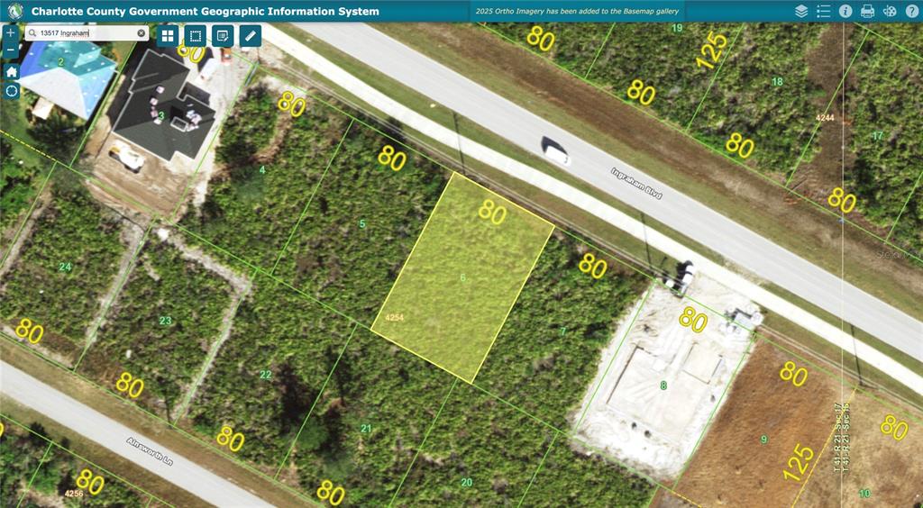 This map shows a highlighted vacant residential lot situated between two other properties — 13509 & 13517 INGRAHAM BOULEVARD, PORT CHARLOTTE, FL