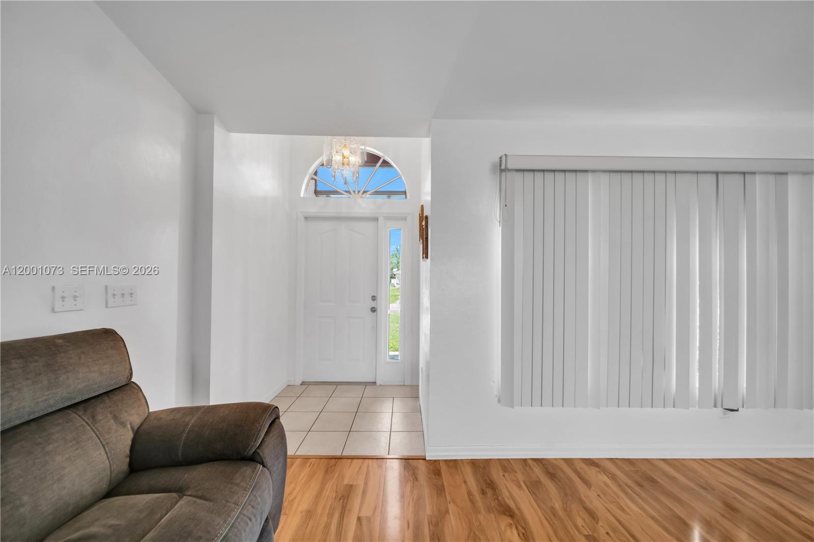 An entryway with tile flooring leads to a front door with a transom window — 2840 NW 2ND TERRACE, Cape Coral FL 33993, CAPE CORAL, FL