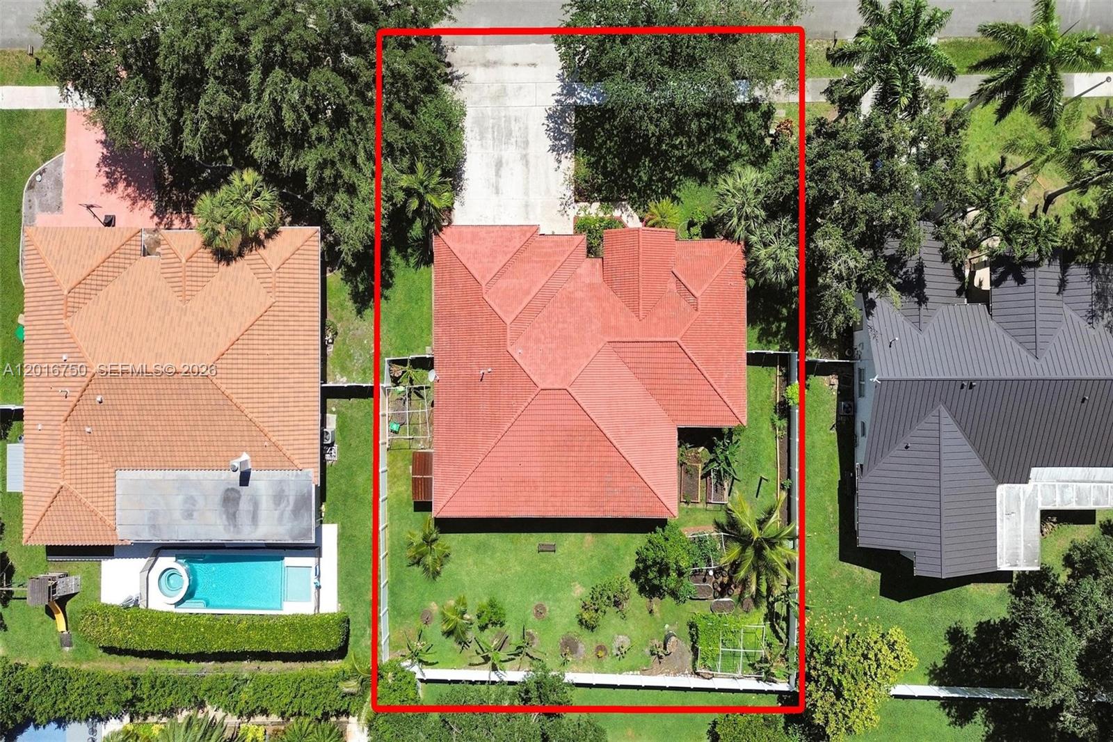 An aerial view shows a house with a red tile roof and a fenced backyard — 4401 SW 74th Ter, Davie FL 33314, DAVIE, FL