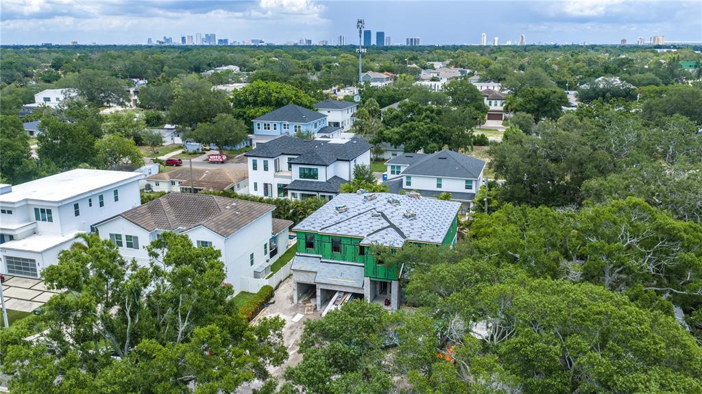 An aerial view shows a residential neighborhood with a house under construction in the foreground — 3618 S GARDENIA AVENUE, TAMPA, FL