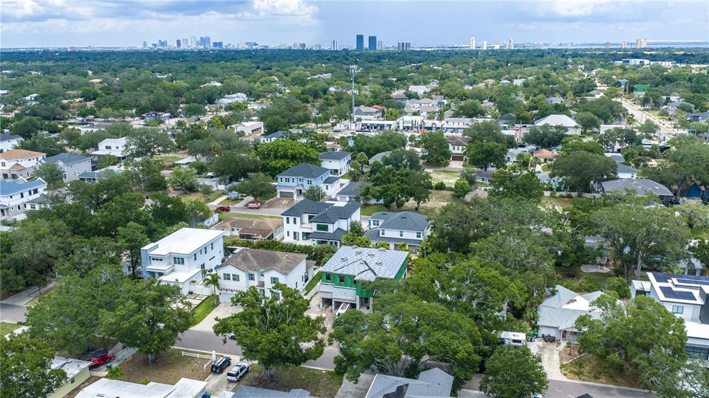 An aerial view shows a suburban neighborhood with several houses, including one under construction — 3618 S GARDENIA AVENUE, TAMPA, FL