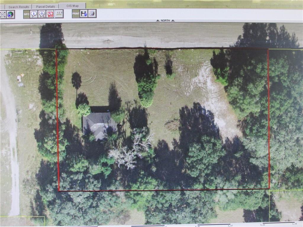This is a GIS map showing an aerial view of a rectangular property with a house — County Road 48 W BELT AVENUE, BUSHNELL, FL