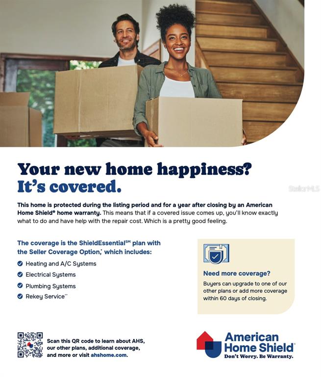 A man and woman carry cardboard boxes while standing in a house with stairs — 2839 MAIDEN GRASS ISLE, WESLEY CHAPEL, FL