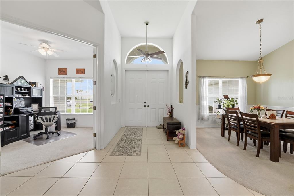 A tiled entryway leads to a home office on the left and a dining room — 2596 SHALIMAR TERRACE, NORTH PORT, FL