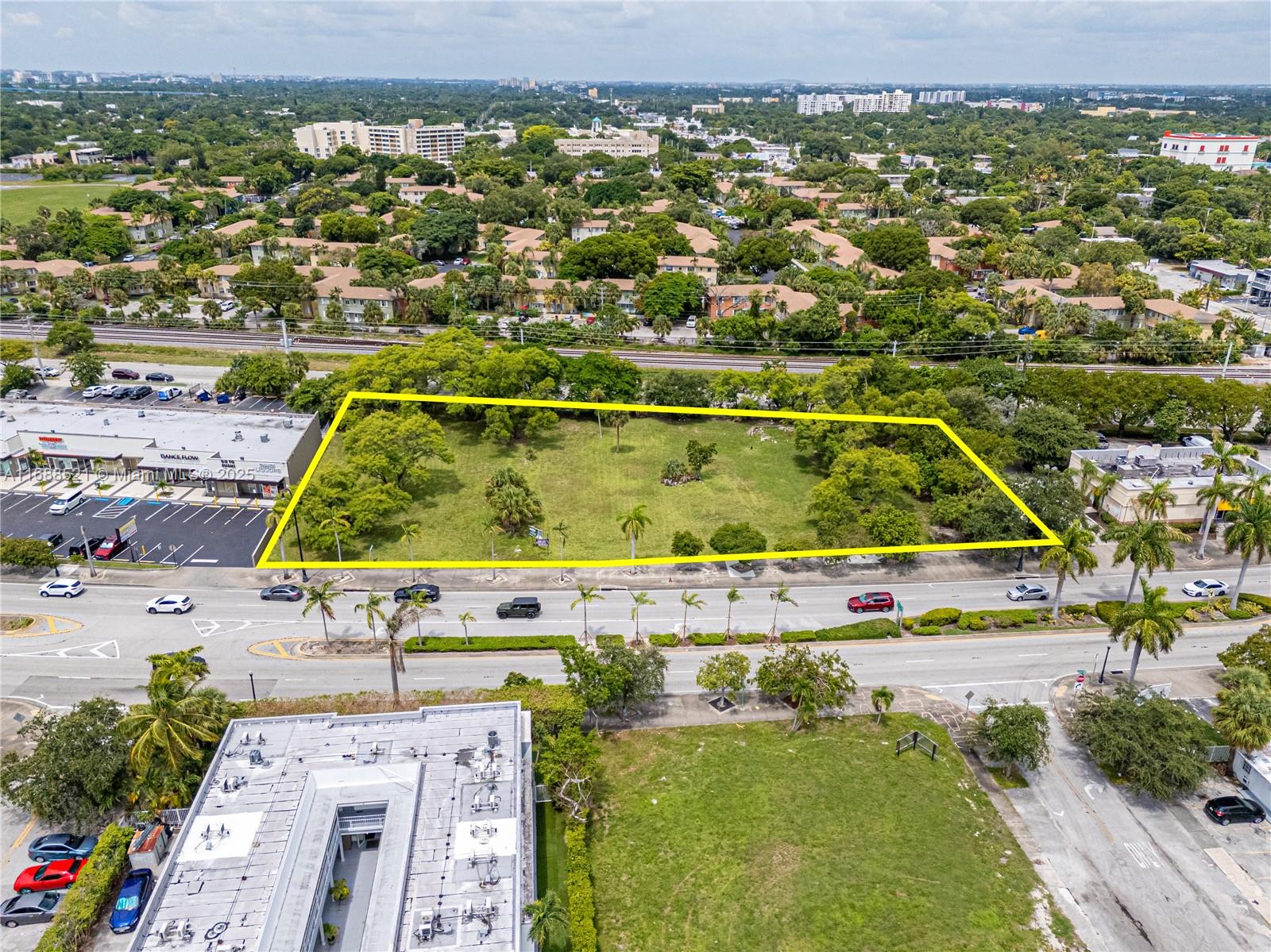 An aerial view shows a vacant rectangular lot outlined in yellow near a commercial area — 5220 Biscayne, Miami FL 33137, MIAMI, FL