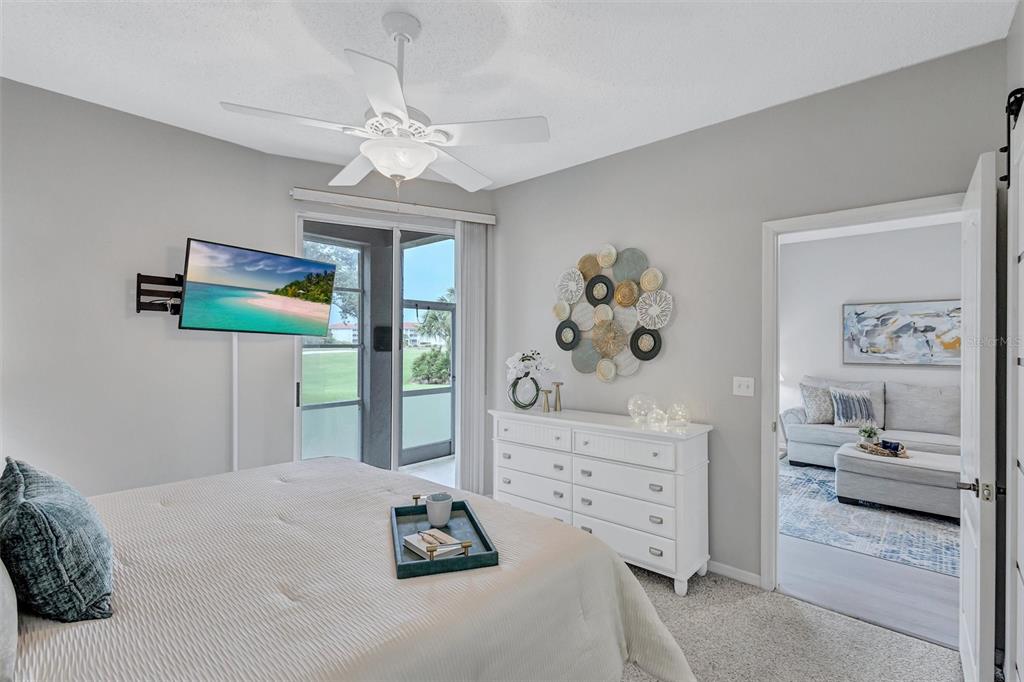 A white kitchen features granite countertops, stainless steel appliances, and an open view to the living area — 9620 CLUB SOUTH CIRCLE UNIT 5107, SARASOTA, FL