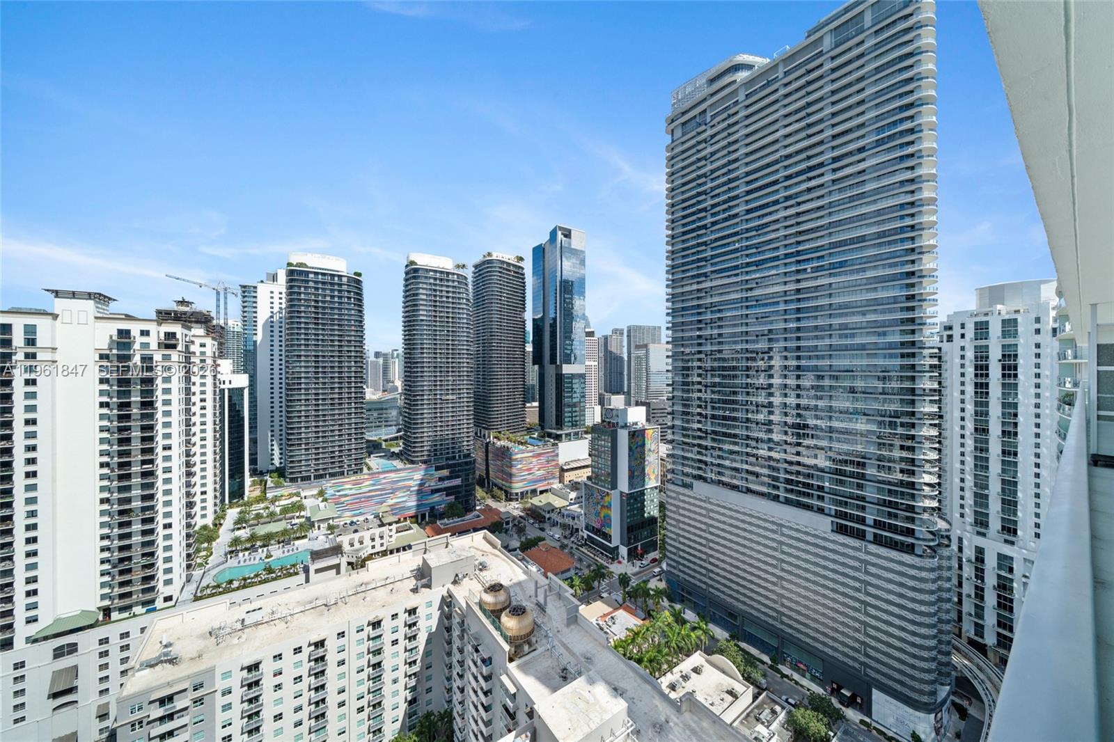 An elevated view of a dense urban skyline featuring numerous high-rise apartment buildings — 1111 SW 1st Ave, Miami FL 33130, MIAMI, FL