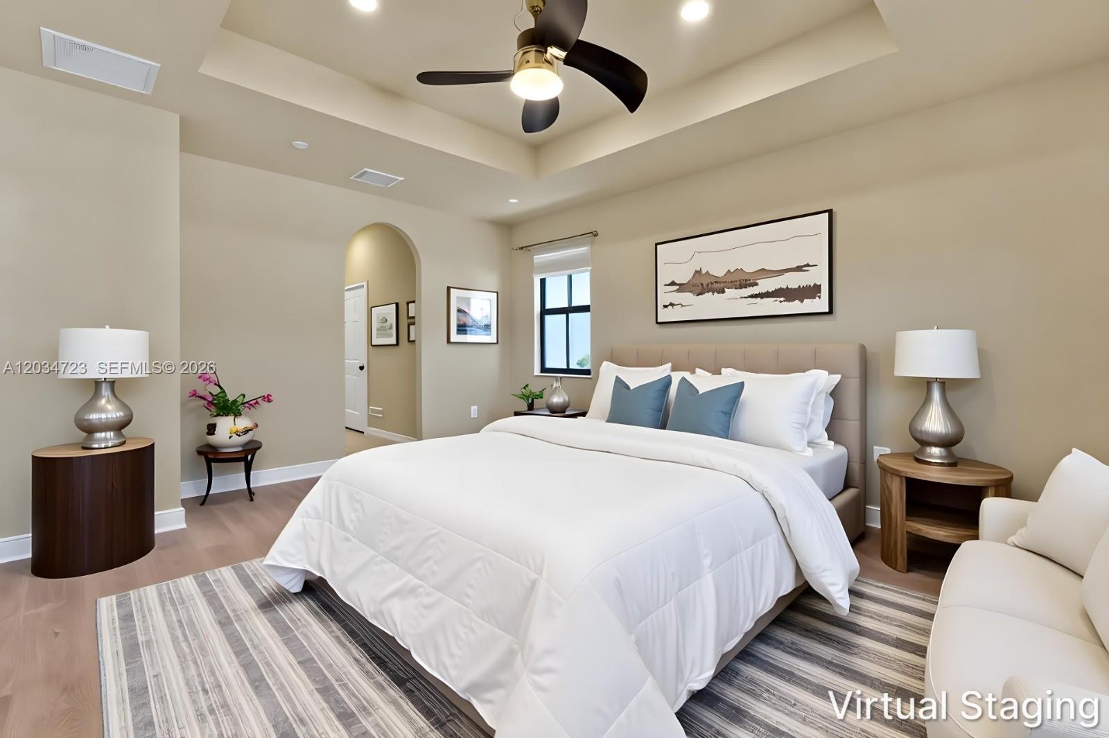 A bedroom with a tray ceiling, a bed, two nightstands, and a ceiling fan — 8890 NW 99th Path, Doral FL 33178, DORAL, FL