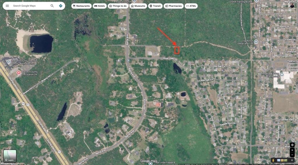 This is a satellite map view showing a highlighted plot of land near River Oaks Drive — 0 RIVER OAKS DRIVE, TITUSVILLE, FL
