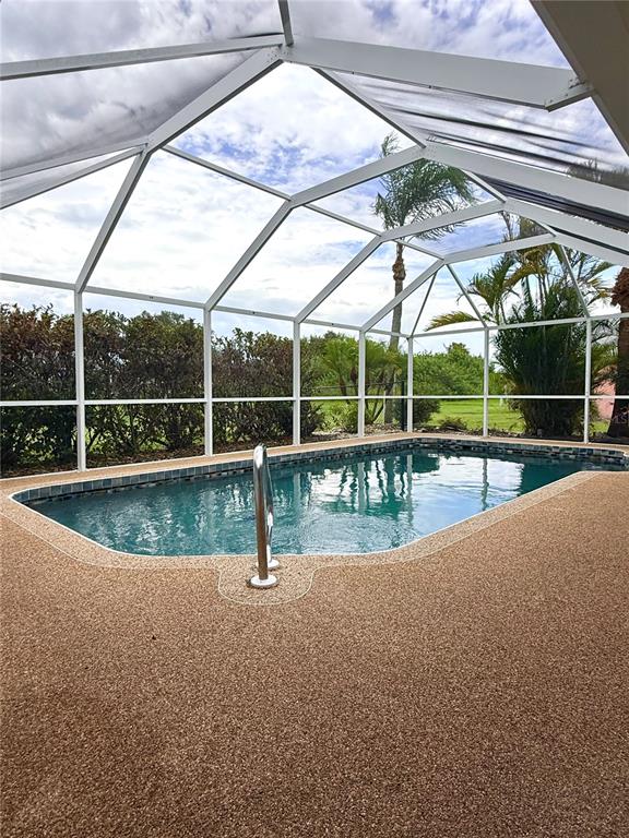 A kitchen features white cabinets, light stone-look countertops, a stainless steel sink, and a dishwasher — 167 MOCHA COURT, PUNTA GORDA, FL