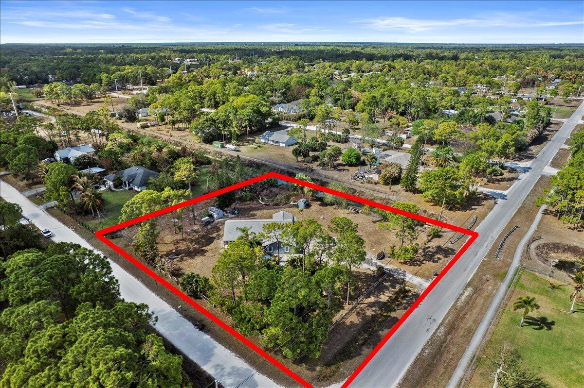 An aerial view shows a house on a large, fenced lot surrounded by trees — 14537 77th Place N, Loxahatchee FL 33470, LOXAHATCHEE, FL