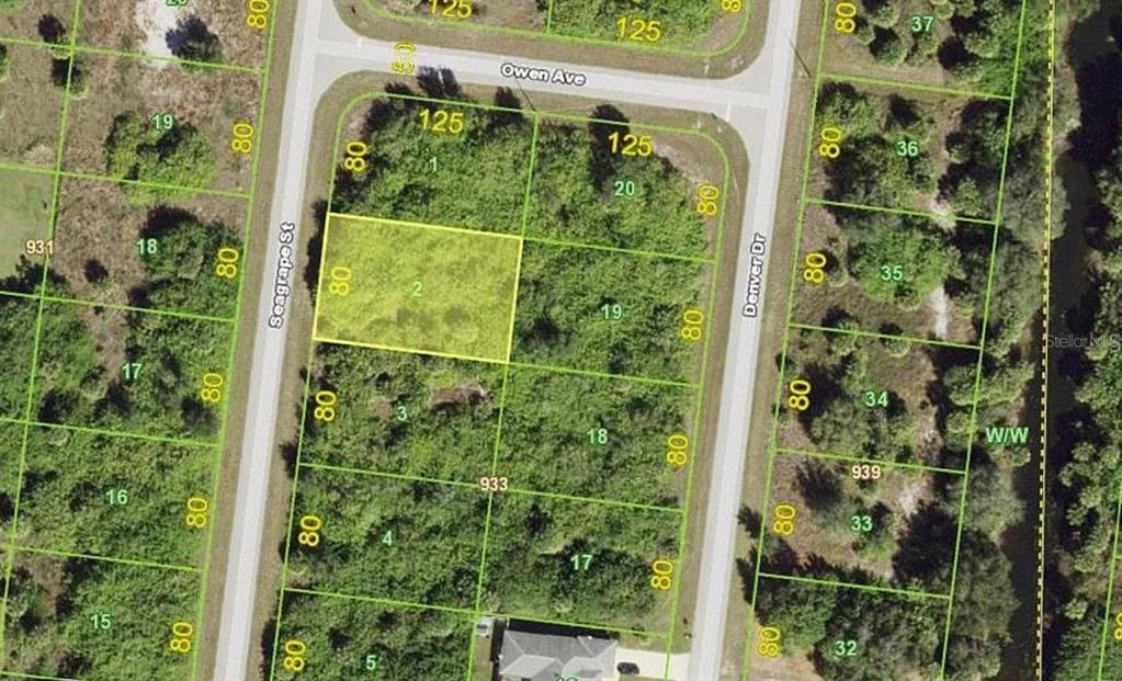 This is an aerial map showing a highlighted vacant residential lot between two paved streets — 138 SEAGRAPE STREET, PORT CHARLOTTE, FL