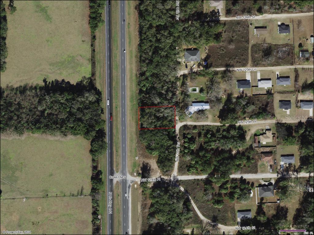 This is an aerial map showing a rectangular plot of land highlighted in red — TBD N US HWY 441 Lot 10, CITRA, FL