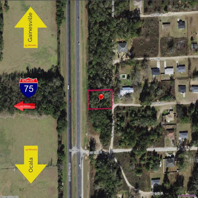 This aerial map shows a vacant, wooded lot highlighted in red next to a highway — TBD N US HWY 441 Lot 10, CITRA, FL