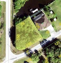 This aerial map shows a vacant, irregularly shaped residential lot highlighted in yellow — 12306 BACCHUS ROAD, PORT CHARLOTTE, FL