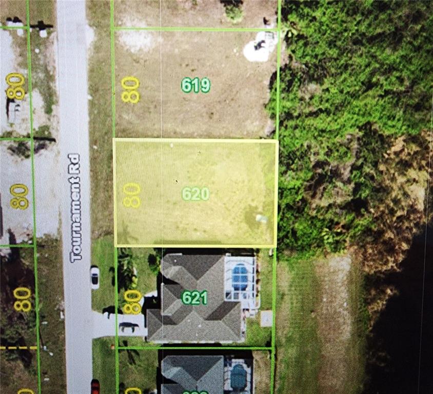 This is an aerial map showing a vacant residential lot highlighted in yellow — 226 TOURNAMENT ROAD, ROTONDA WEST, FL