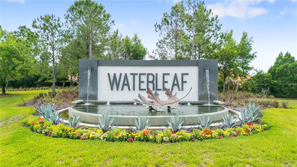A stone monument sign for Waterleaf sits in front of a circular water fountain — 11814 CROSS VINE DRIVE, RIVERVIEW, FL