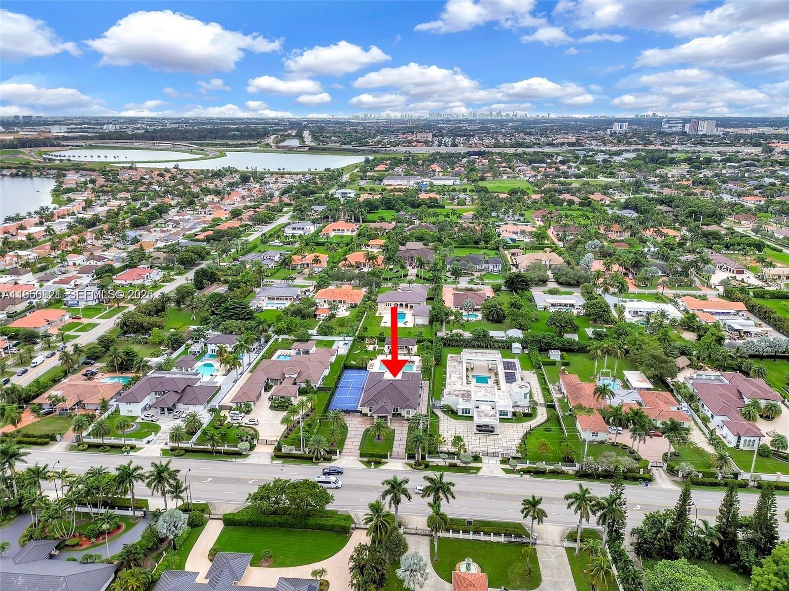 An aerial view shows a residential property with a tennis court and swimming pool — 433 NW 127th Ave, Miami FL 33182, MIAMI, FL