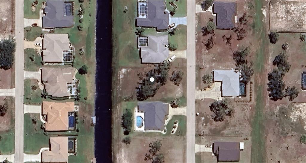 This aerial map view shows residential houses situated along a canal and local streets — 192 MARINER LANE, ROTONDA WEST, FL