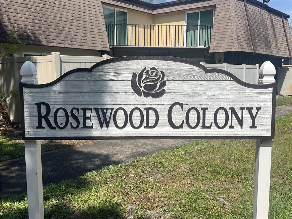 A sign for Rosewood Colony stands in front of a multi-story residential building — 4026 SHANNON BROWN DRIVE, ORLANDO, FL