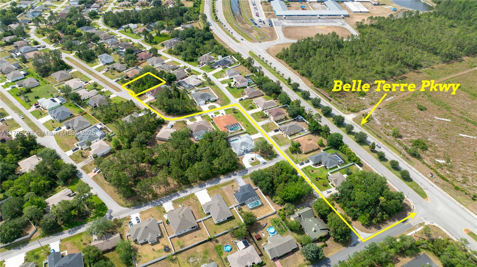 This aerial view shows a residential neighborhood with a highlighted vacant lot and nearby road — 35 Butternut Dr., Palm Coast FL 32137, PALM COAST, FL