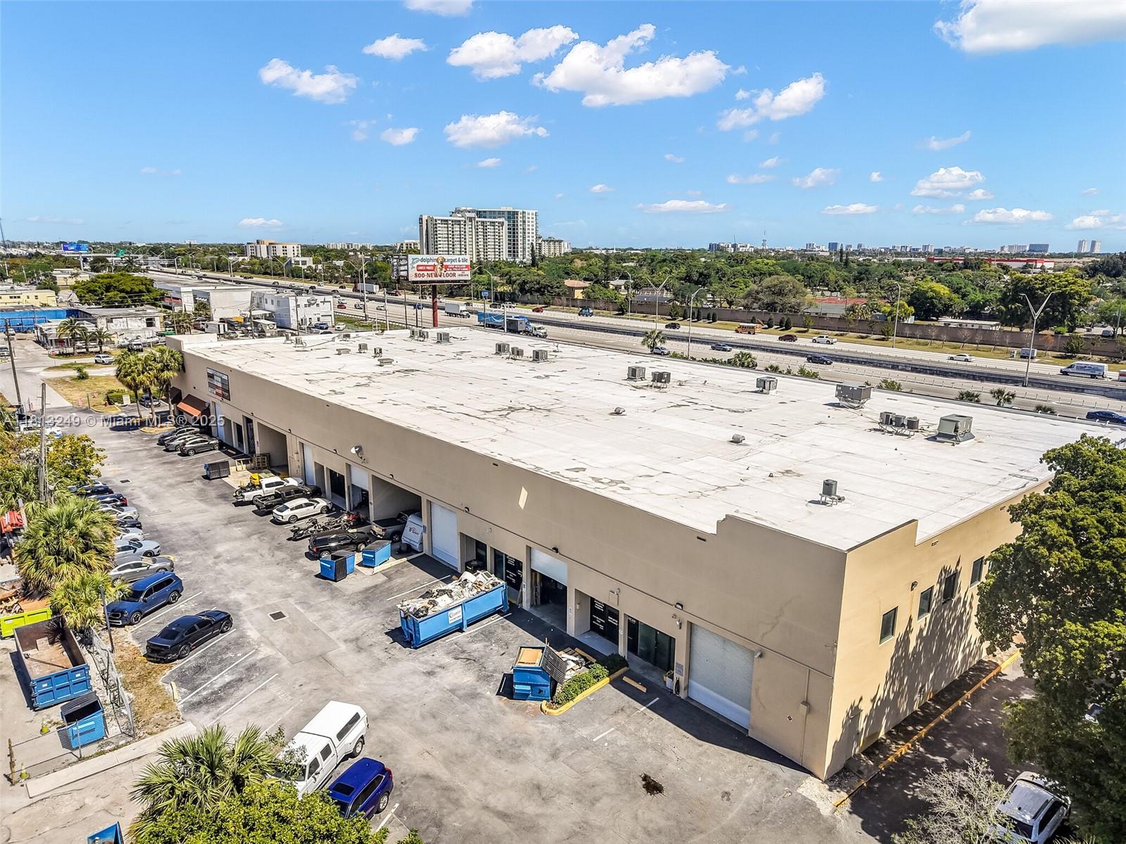 An aerial view shows a commercial warehouse building with a flat roof and parking lot — 820 SW 12th Ave # 7B, Pompano Beach FL 33069, POMPANO BEACH, FL