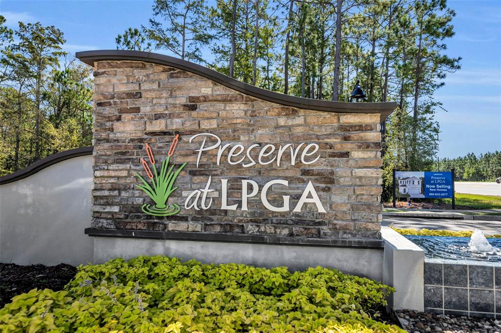A stone monument sign for Preserve at LPGA stands in front of trees and landscaping — 1156 SAND TRAP COURT, DAYTONA BEACH, FL