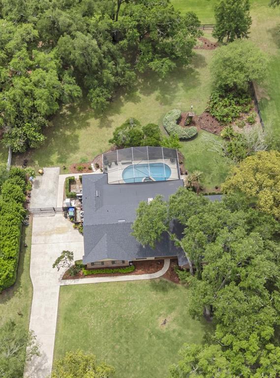 A single-story brick and siding house with a large front lawn and mature oak tree — 14140 COUNTRY ESTATE DRIVE, WINTER GARDEN, FL