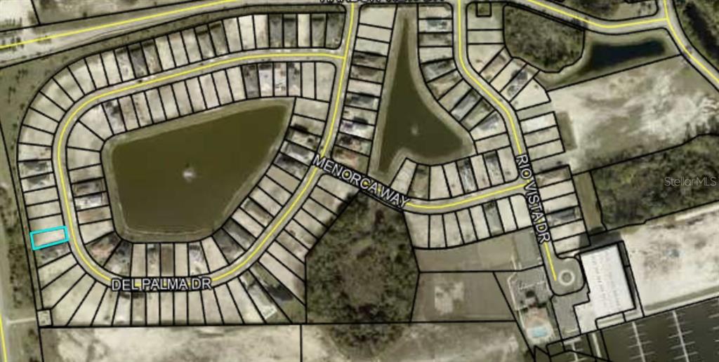 This is an aerial map showing residential lots surrounding a pond and neighborhood streets — 62 DEL PALMA DRIVE, PALM COAST, FL