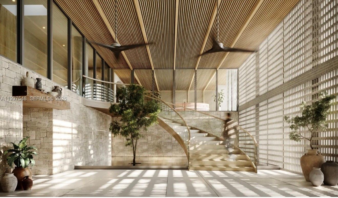 This architectural rendering shows a modern foyer with a curved staircase, stone walls, and slats — 1177 Kane Concourse # 608, Bay Harbor Islands FL 33154, BAY HARBOR ISLANDS, FL