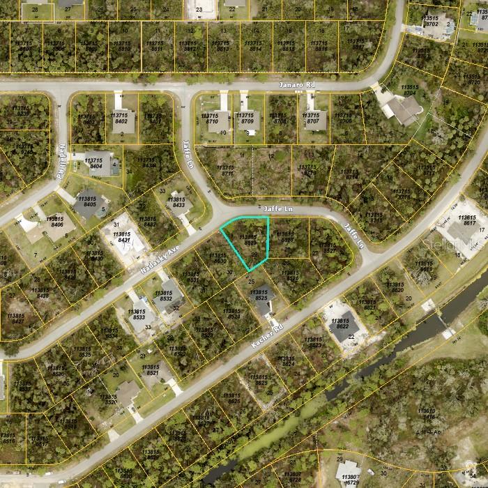 This is an aerial map showing a highlighted vacant lot situated at a street intersection — JAFFE LANE, NORTH PORT, FL