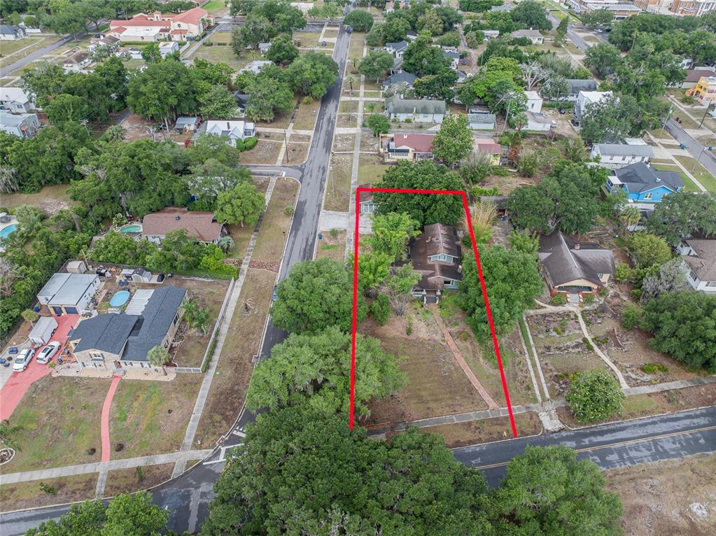 An aerial view shows a house on a large lot outlined in red — 116 S LAKESHORE BOULEVARD, LAKE WALES, FL