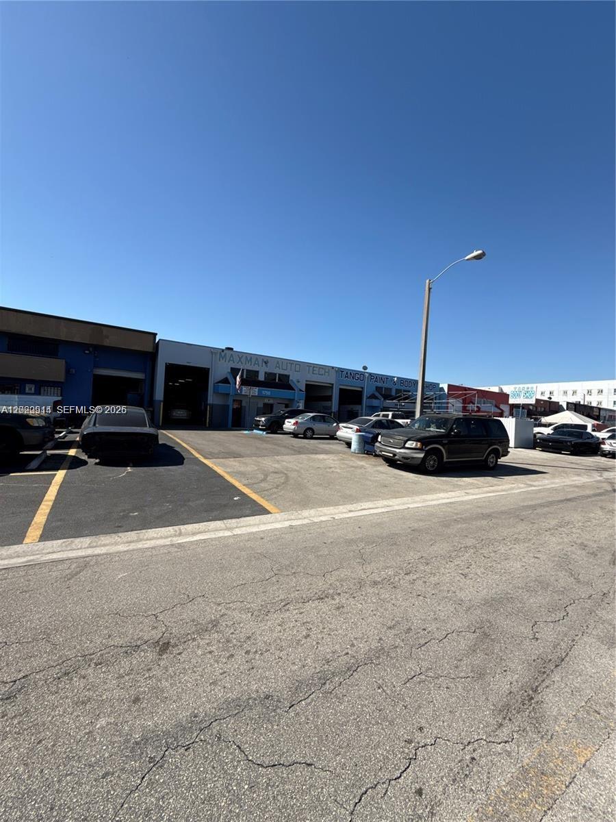 An exterior view of an auto repair shop with a parking lot in front — 1750 W 41st St, Hialeah FL 33012, HIALEAH, FL