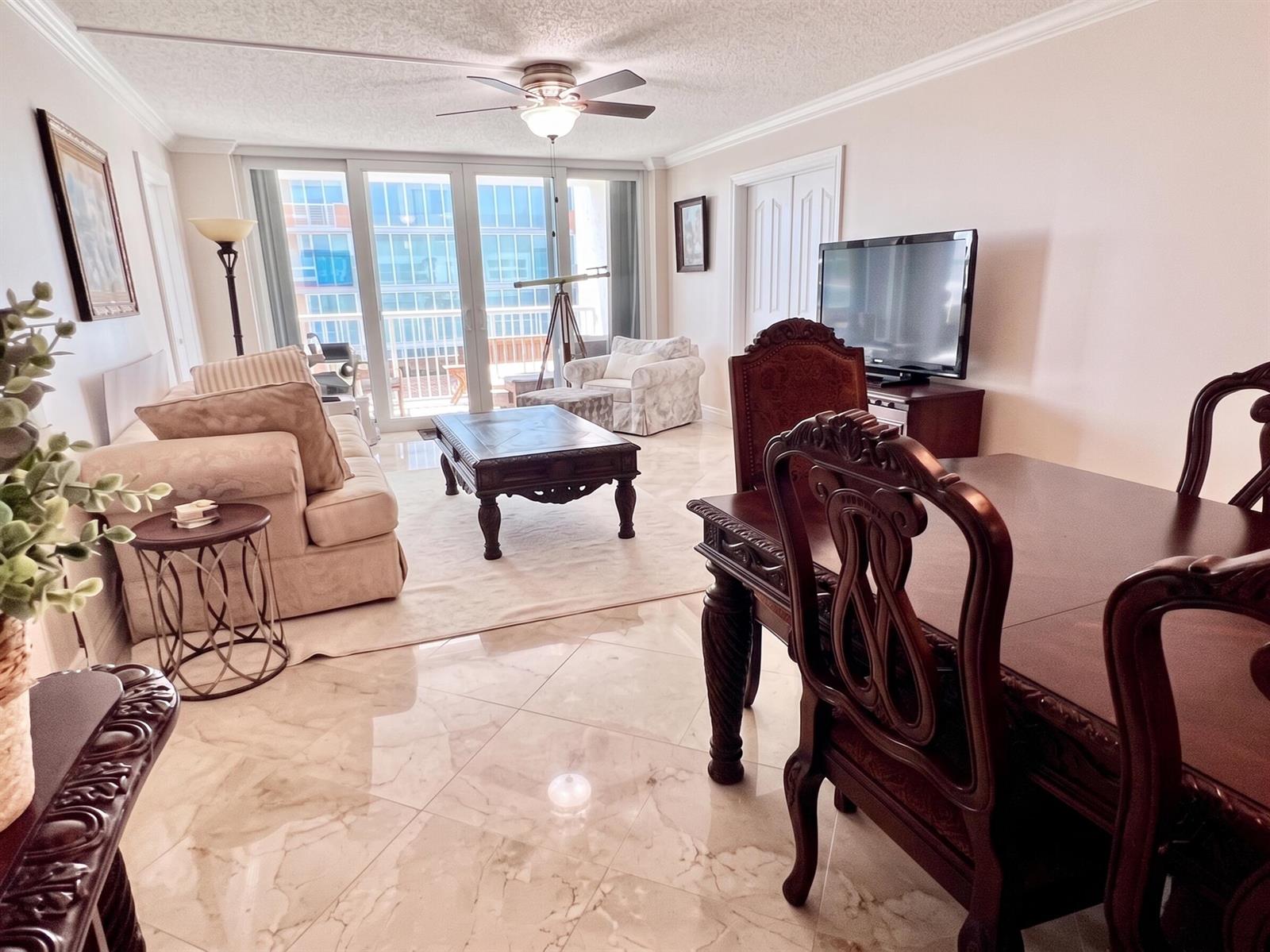 A spacious room with light-colored tile flooring, recessed lighting, and mirrored closet doors — 1370 S Ocean Boulevard # 603, Pompano Beach FL 33062, POMPANO BEACH, FL