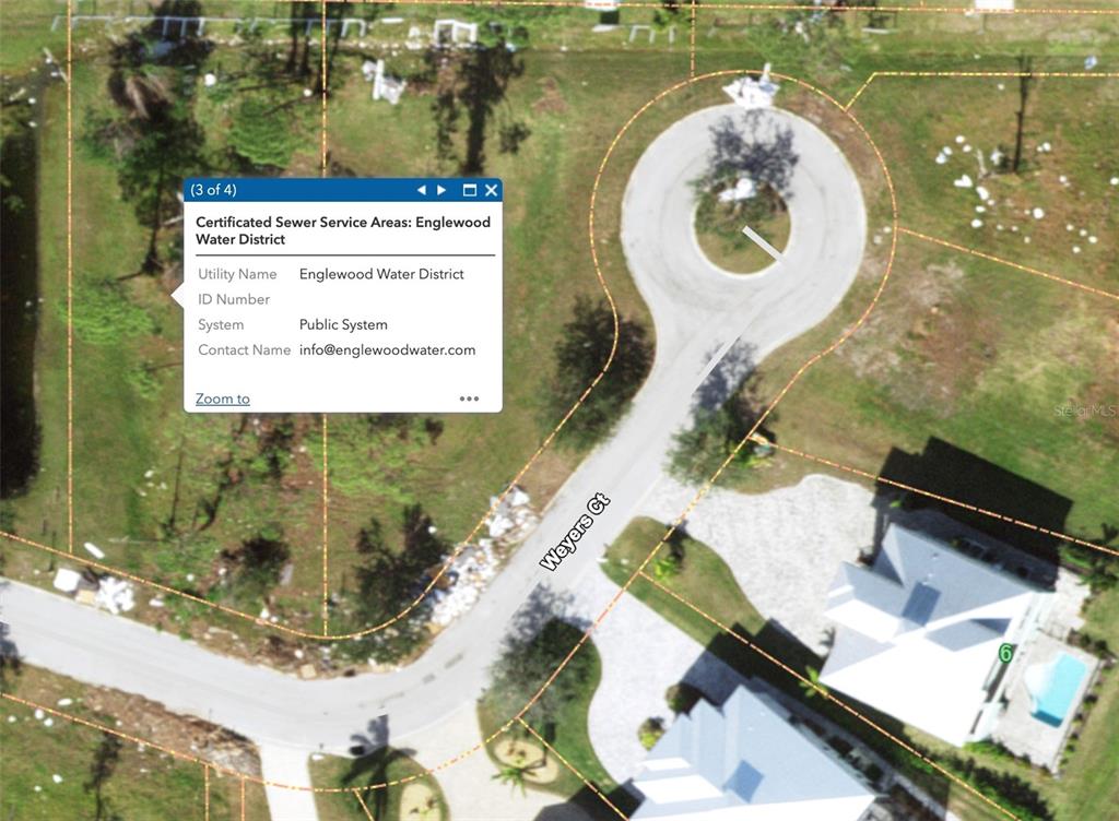 This is an aerial map showing a cul-de-sac and a sewer service area information box — 8040 WEYERS COURT, ENGLEWOOD, FL