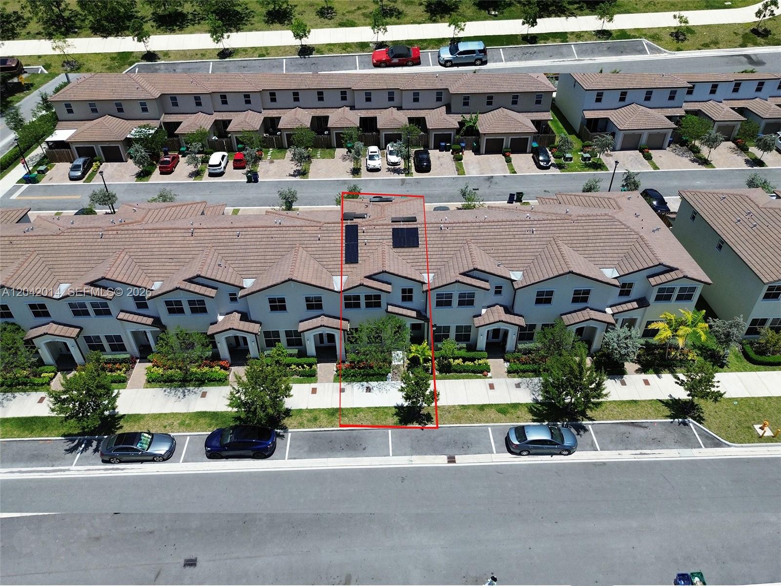 An aerial view shows a row of townhouses with a red outline highlighting one unit — 12867 SW 243rd Ter, Homestead FL 33032, HOMESTEAD, FL