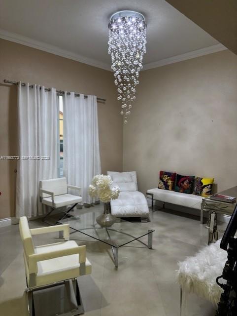 A living room features a crystal chandelier, white chairs, a glass coffee table, and seating — 1710 SW 154th Path, Miami FL 33185, MIAMI, FL