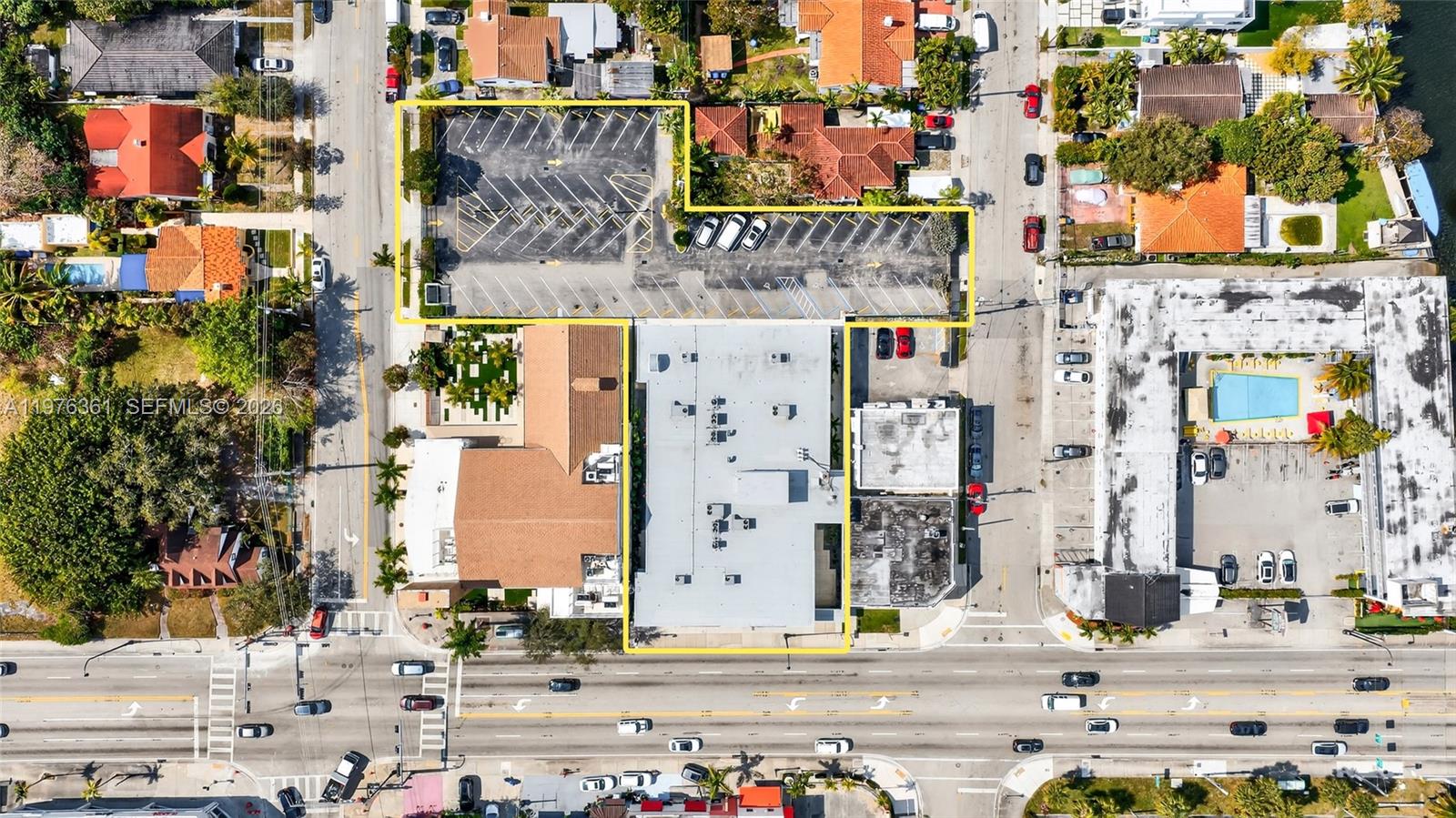 This aerial view shows a commercial building with an adjacent parking lot — 7630 Biscayne Blvd, Miami FL 33138, MIAMI, FL