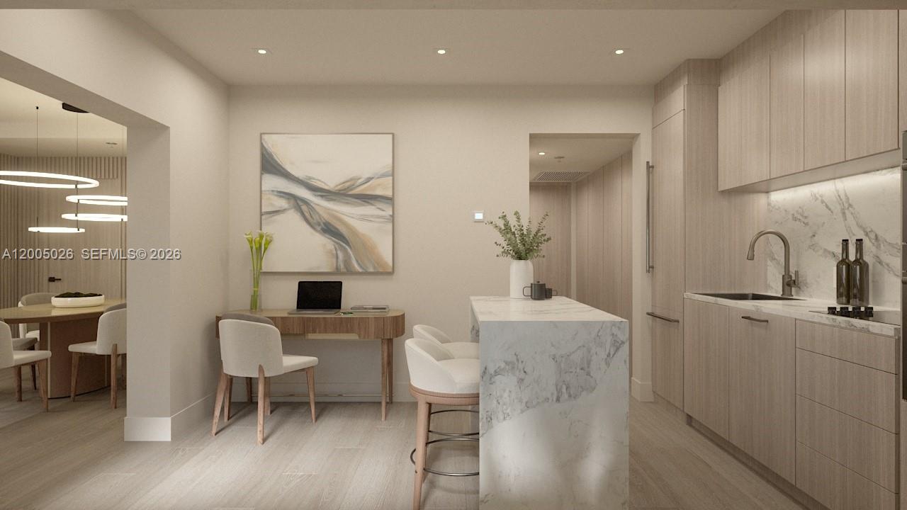 This rendering shows a modern kitchen and dining area with light wood cabinetry and marble — 260 Collins Ave # 205, Miami Beach FL 33139, MIAMI BEACH, FL