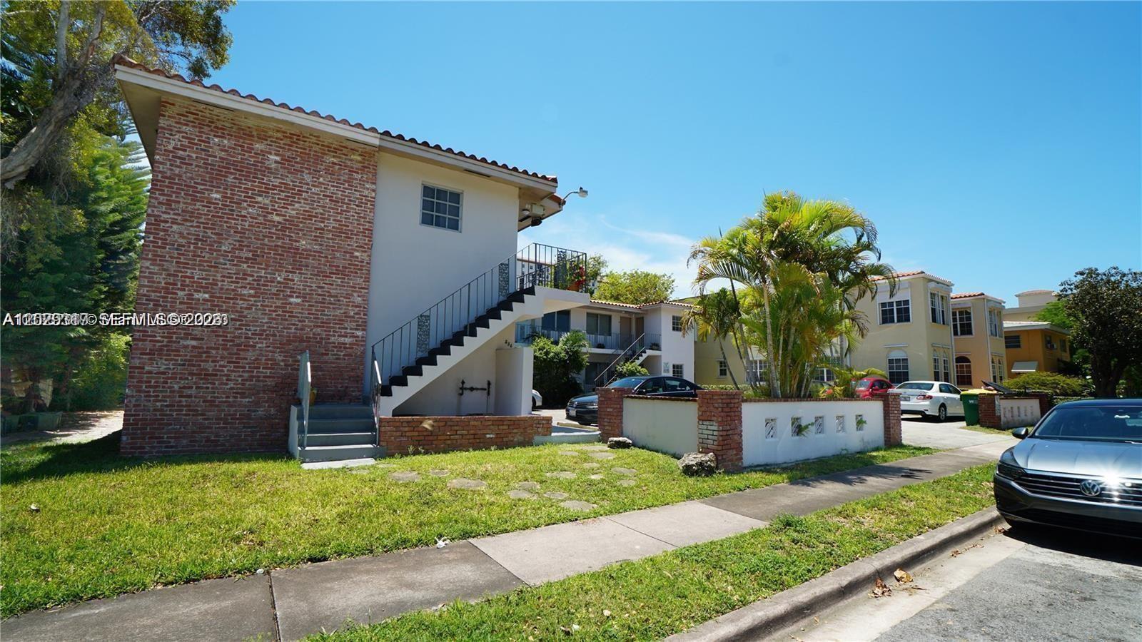 A two-story apartment building with a brick exterior and an outdoor staircase — 236 Madeira Ave # 6, Coral Gables FL 33134, CORAL GABLES, FL